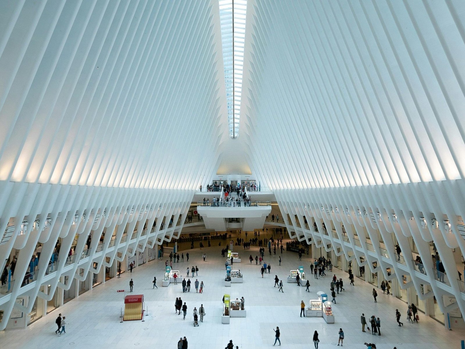 Modern architectural view of the Oculus in NYC, showcasing its futuristic design and bustling interior.
